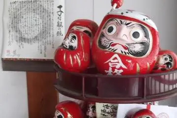 Darumas resting on their stand
