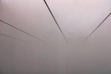 Riding the ropeway through the clouds