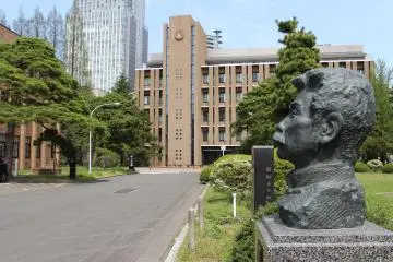 A statue of Japan's first international student Lu Xun contemplates at the edge of the garden courtyard. The classroom where Lu Xun studied (not pictured), is also a cultural property located nearby.