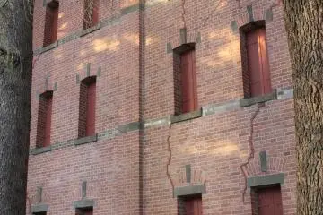 The former multi-floor library stack is now used to store university artifacts (not open to the public), and is a shady spot for students to park their bicycles.