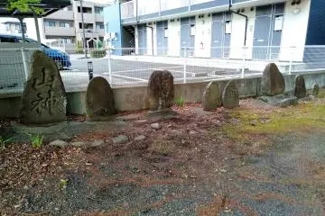 Historical stone tablets line an edge of the precincts