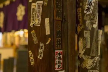 Religious seals line the beams of the Hozenji Yokocho temple between Dotonbori and Nanba