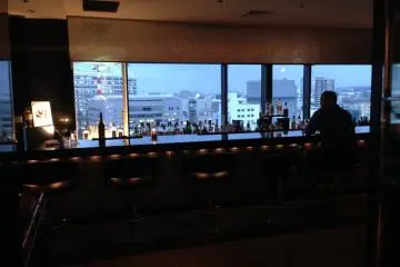 Watching the city at the rooftop bar