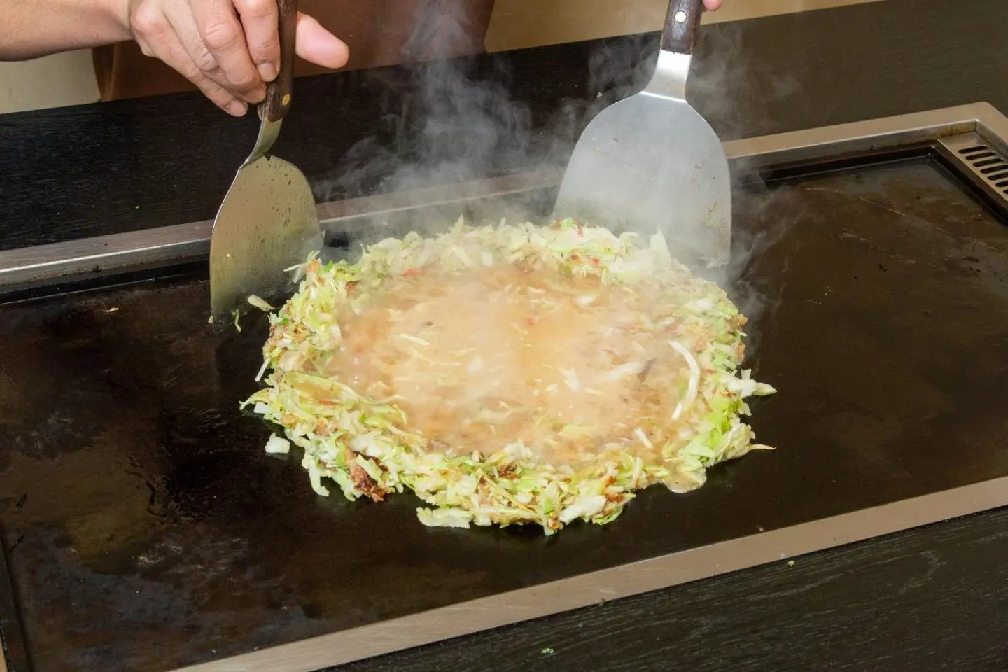Try this regional treat! (Photo: Tsukishima Monja Street)