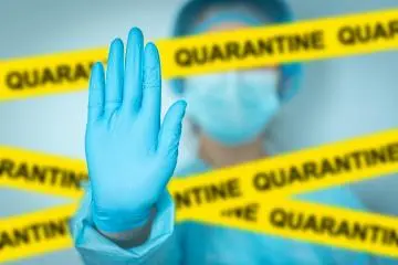 Photo: <a href="https://foto.wuestenigel.com/concept-quarantine-alert-with-blurred-doctor-with-mask-and-protective-suit-doctor-and-isolation-with-yellow-ribbons-for-quarantine/" target="_blank" rel="noreferrer noopener nofollow">Marco Verch</a> / <a href="https://creativecommons.org/licenses/by/2.0/" target="_blank" rel="noreferrer noopener nofollow">CC BY 2.0</a>