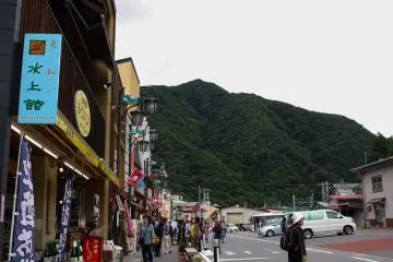 While the massive mountains watch over you, have a bite of Onsen Manju from the store lined streets.