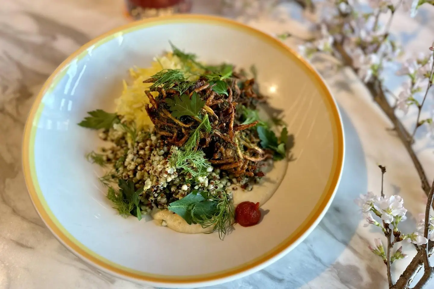 Celeriac and Ginger fritters, buckwheat, butter bean puree, yellow beetroot, and harissa