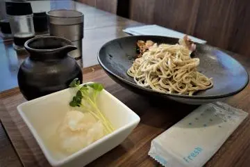 Freshly hand cut soba noodles with garnish