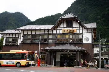 Buses #20 and #21 (as shown in the photo) stop in front of the station
