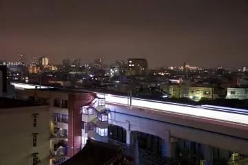 Facing Southwest again: Light trail of the train passing through Kamata