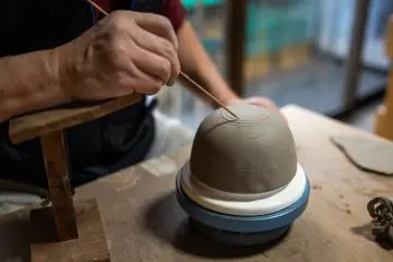 Mr. Fukuda teaching me how to prepare the bottom of the bowl I was making in his shop