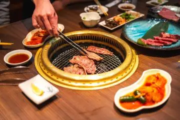 Cooking Hida beef at a yakiniku restaurant in town