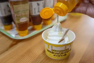 Pouring delicious local honey over my ice cream