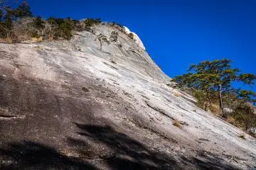 Menboko, the largest bare slab of rock in Japan, is on the trail up Mt. Hoko