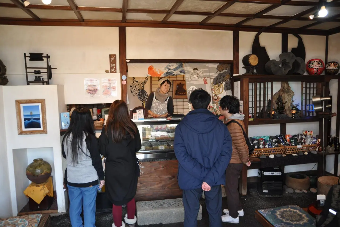 Ms. Kawamura graciously serves a steady flow of fans