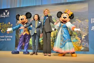 Mickey Mouse and Minnie Mouse wearing new costumes for "Fantasy Springs Special Greetings"