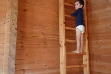 Wooden ladder leading up to the loft