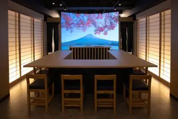 Indoors with a very large screen
