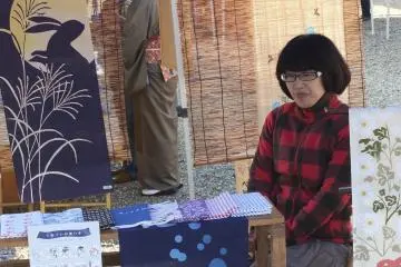 Vendor selling traditional "Tenugui"