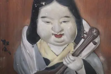 Raised carving of the Goddess of Art, Benten