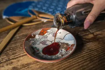 Pouring some of the delicious soy sauce at Mrs. Okami’s brewery