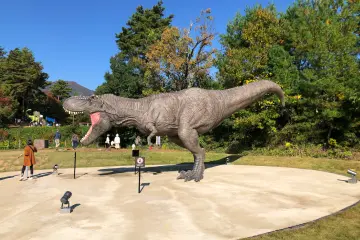 The Tyrannosaurus Monument, right by a big park with dinosaur-themed playground equipment!