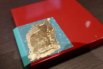 Adding gold leaf to stencil