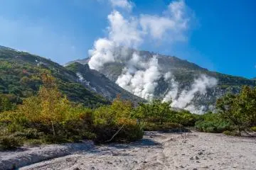 Sulfuric vapor rises from volcanic vents on Mt. Io