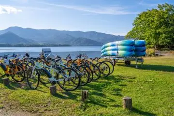 Taking a break along Lake Kussharo after cycling and kayaking