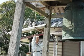 Bell ringer and his bell