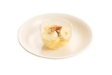 Pudding with banana and bread, drizzled in honey — Yemen
