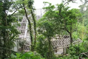 <p>One of the side paths leads to a blocked off area that is off limits to visitors; its unknown how long this abandoned construction site has existed, but the wooden structure has endured at least a few years without collapsing</p>