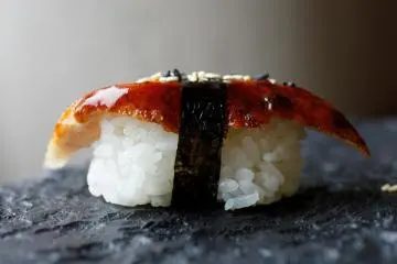 Eel nigiri sushi, with a slice of eel over rice
