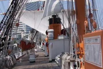 The ship itself is gorgeous, with big white sails, wooden decks that shine with polish, and ropes and knots and other ship stuff that is very impressive.