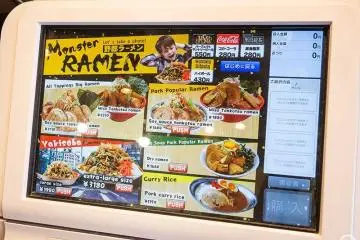 Touch panel ticket vending machine with English and Japanese language