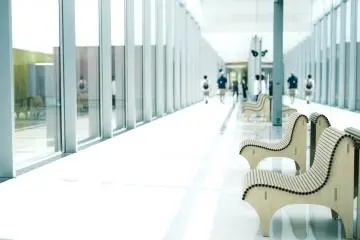 The benches display Shigeru Ban's aesthetic
