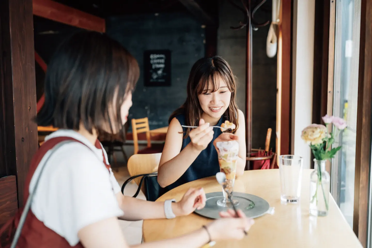 Two friends enjoying a parfait