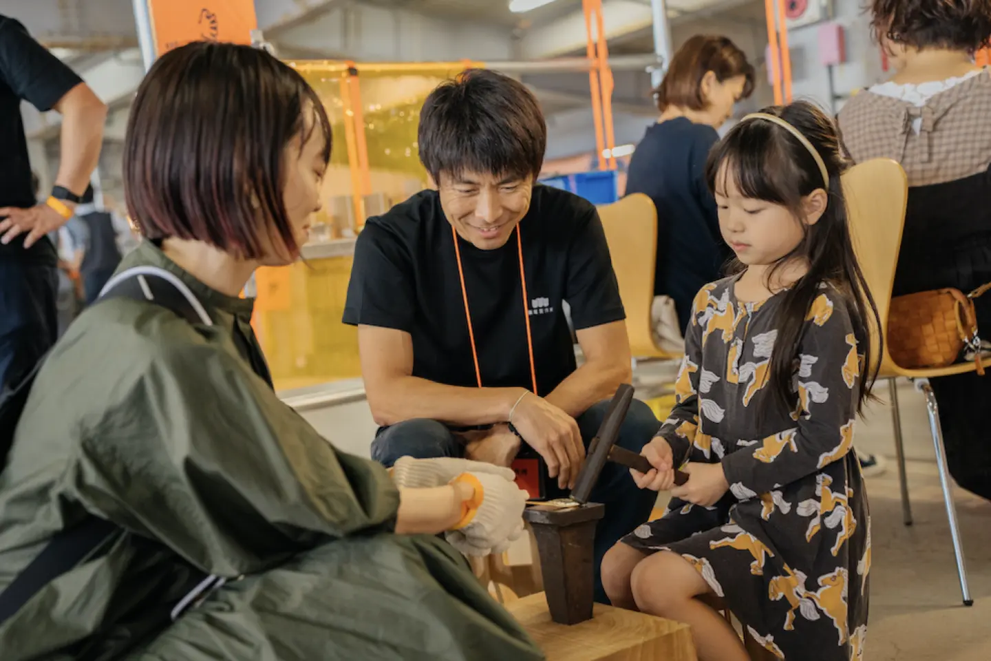 A young girl experiencing crafts at Craft Fair Tsuginote