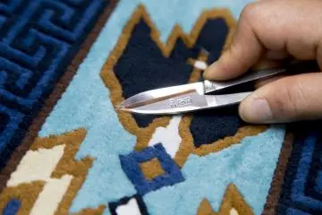 Trimming a tatami-sized rug at Ako Dantsu Studio Gallery Higashihama