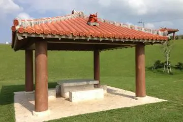<p>There are a half dozen pavilions complete with red Ryukyuan tile roofs, a Shisha dogs, and concrete table and chairs</p>