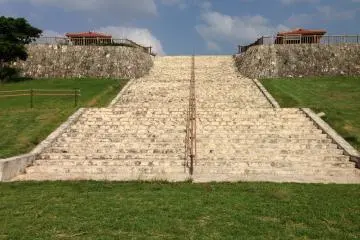 <p>The limestone steps that lead to the basketball courts at the uppermost tier of the park</p>