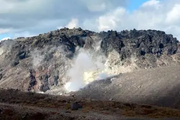 Lava dome and fumes after hiking to Mount Tarumae’s summit