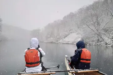 Canoeing on Lake Shikotsu during snowfall