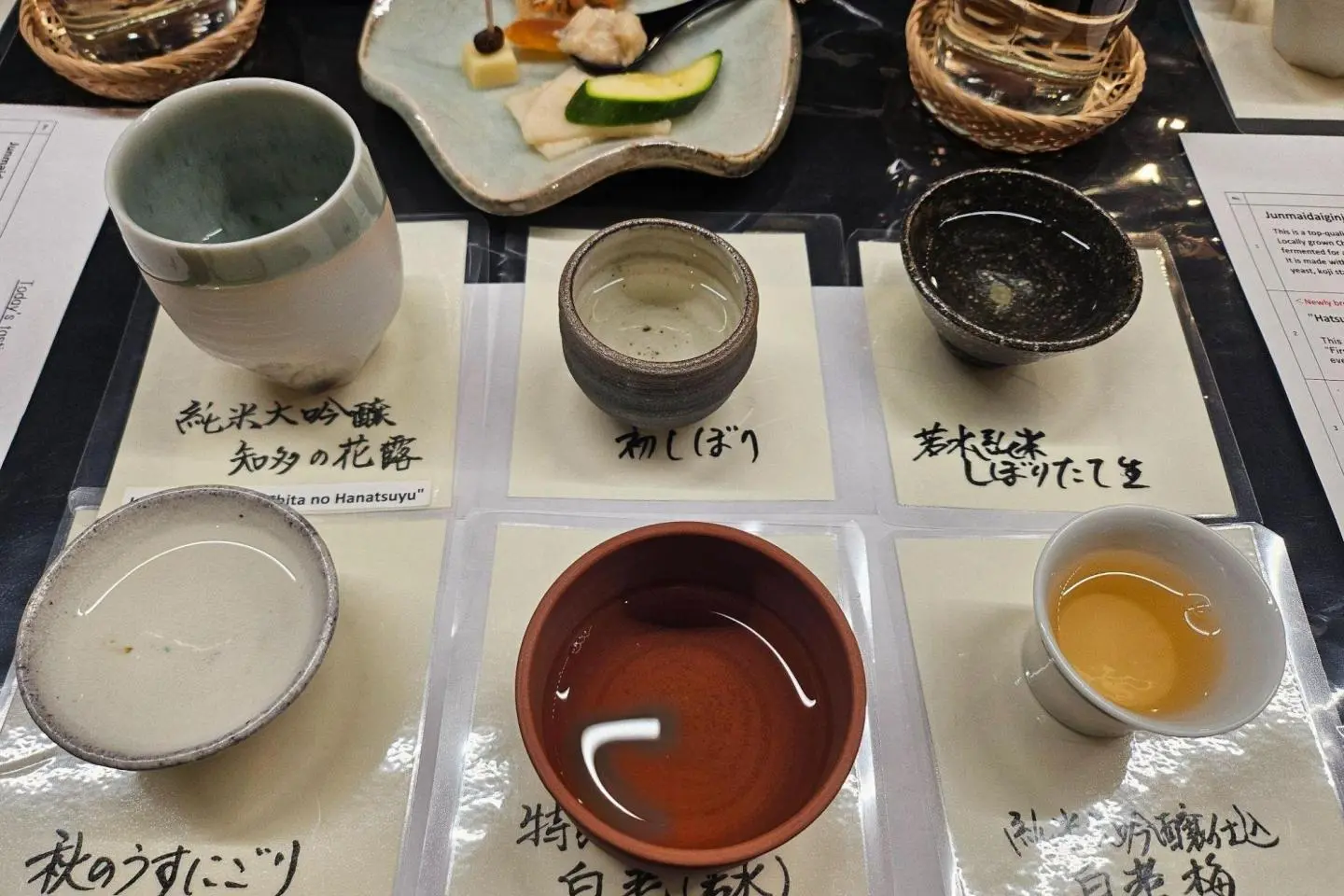 A selection of Sawada Sake Brewery sakes in traditional Tokoname cups