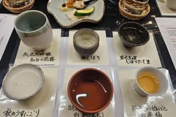 A selection of Sawada Sake Brewery sakes in traditional Tokoname cups