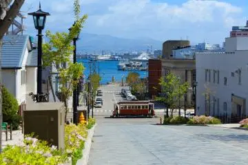 Hakodate’s tram passing through a picturesque street