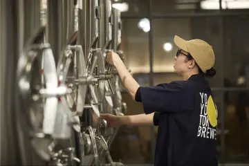 Pouring a beer during a YONA YONA Tokyo Brewery tour