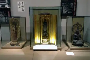 Buddhist figurines rest in a corner of the IDEHA commemorative hall.