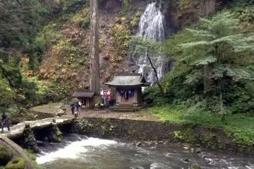 The walk up Mt. Haguro is filled with natural beauty. Before reaching the large pagoda you will traverse a bridge overlooking a waterfall.