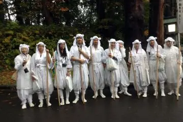 Our tour group is all smiles in our yamabushi clothing after successfully climbing Mt. Haguro and being blessed in the main shrine.